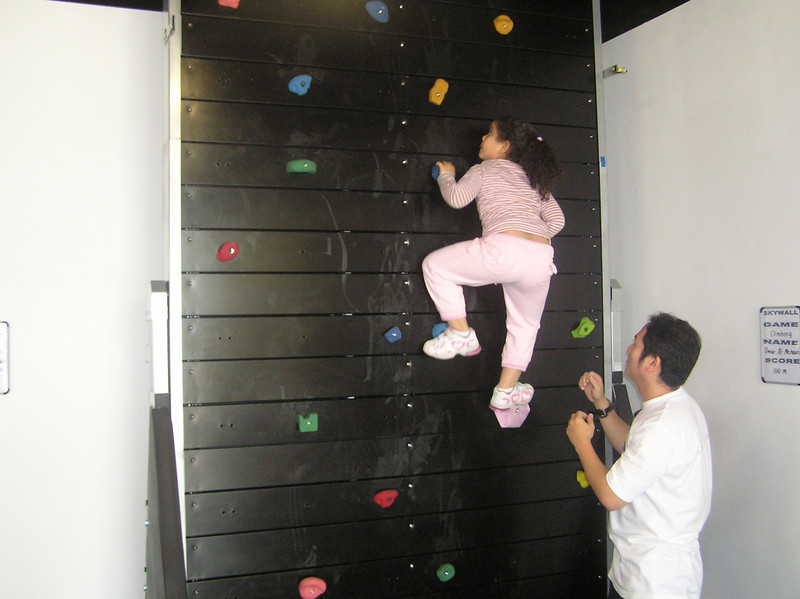 A kid reaching new heights by climbing on the Skywall